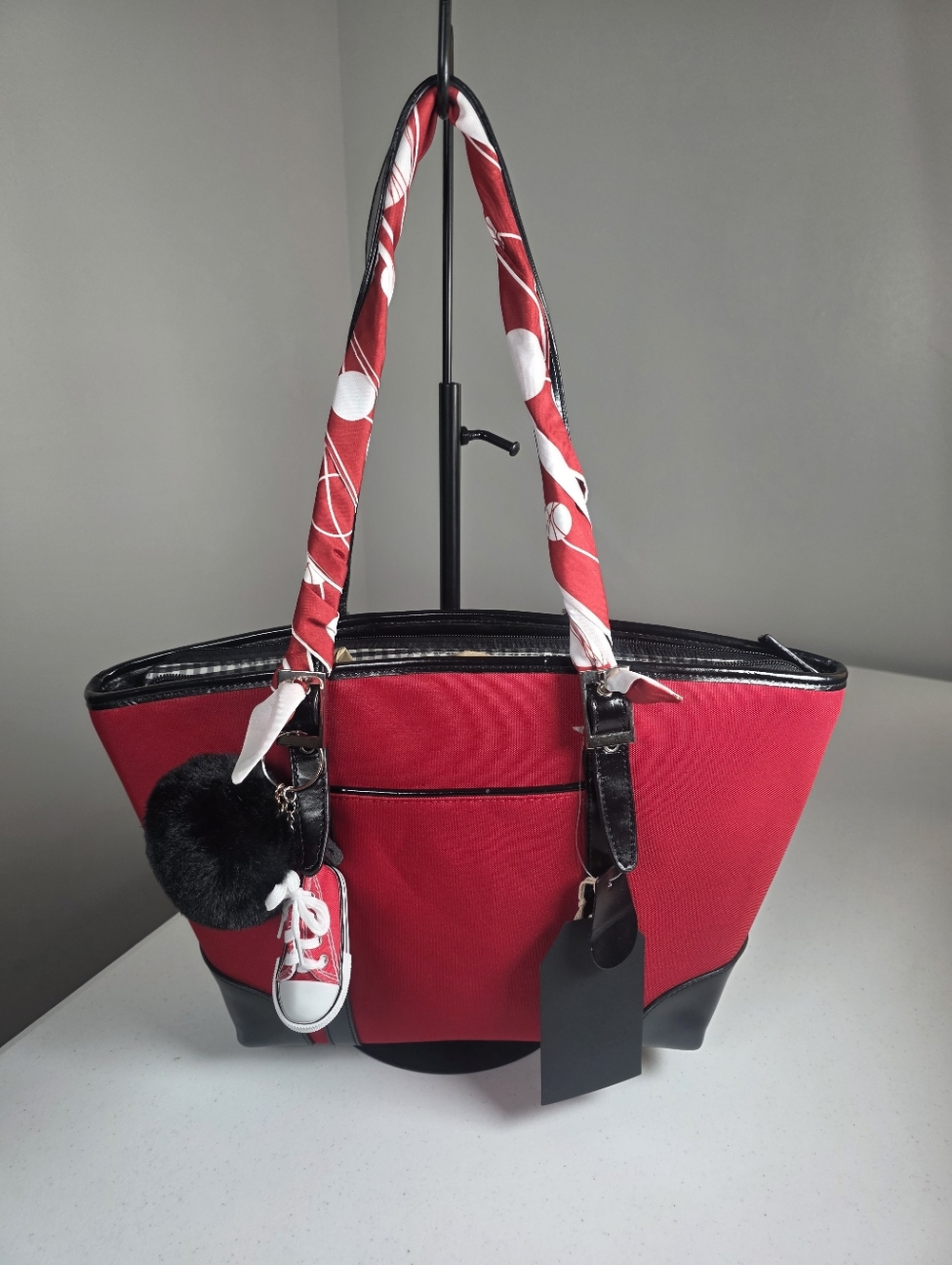 Red Women's Tote Bag with Black Trim and Decorative Charm